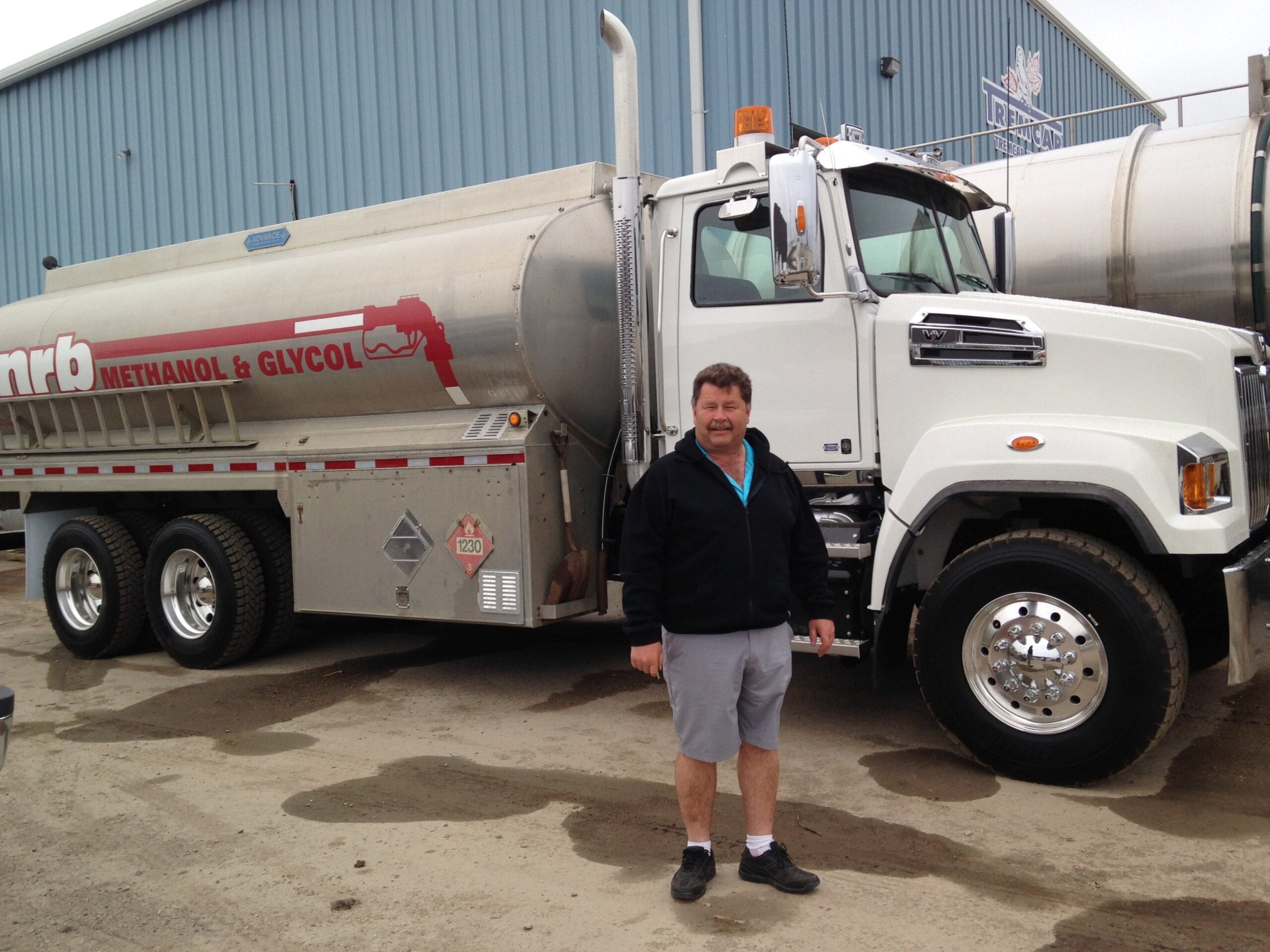 Person standing in front of the NRB truck Person standing in front of the NRB truck